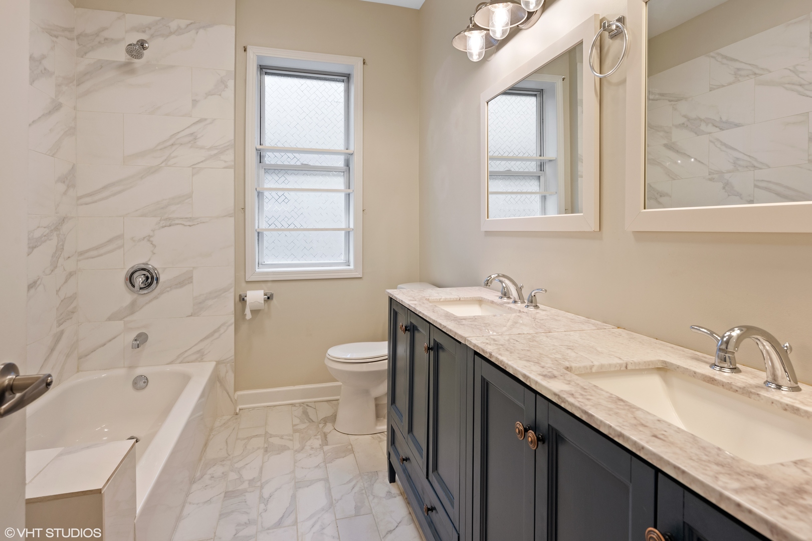 4944 North Drake Avenue, Unit 2 Chicago, IL 60625 - Photo 11 of 13 a bathroom with a granite countertop sink a toilet and shower