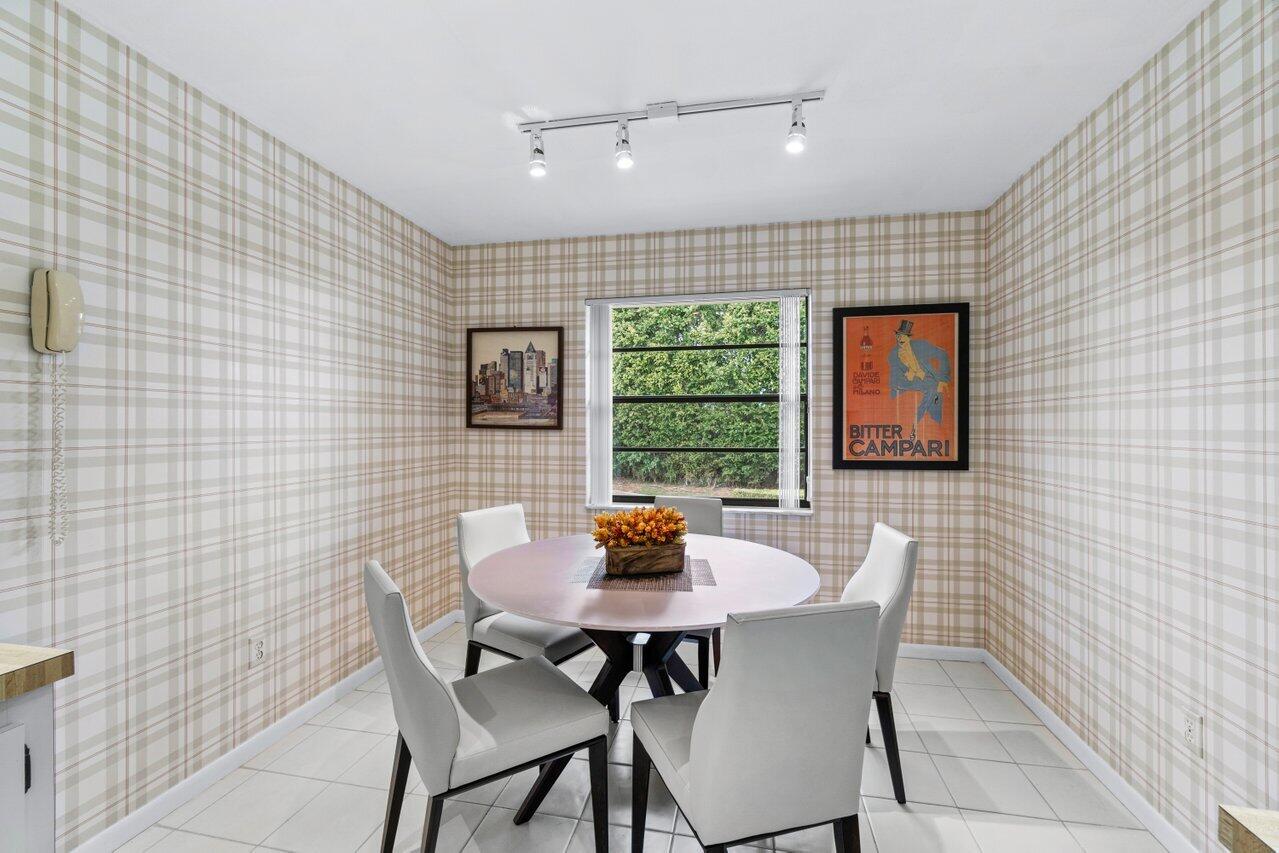 20 Westgate Lane, Unit B Boynton Beach, FL 33436 - Photo 15 of 46 a dining room with furniture and window