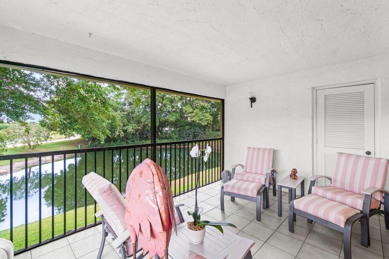 20 Westgate Lane, Unit B Boynton Beach, FL 33436 - Photo 20 of 46 a view of a two chairs in the balcony