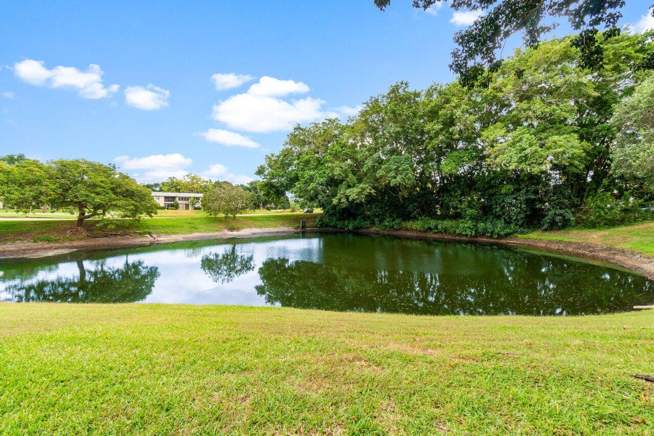 20 Westgate Lane, Unit B Boynton Beach, FL 33436 - Photo 24 of 46 a view of a lake from a yard