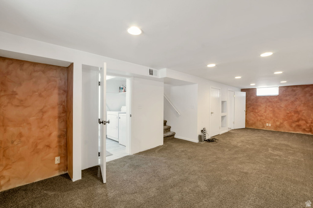 7391 Elm Street Midvale, UT 84047 - Photo 17 of 38 Huge!!! Expansive carpeted area with recessed lighting, textured accent walls, and a separate laundry area with built-in shelving
