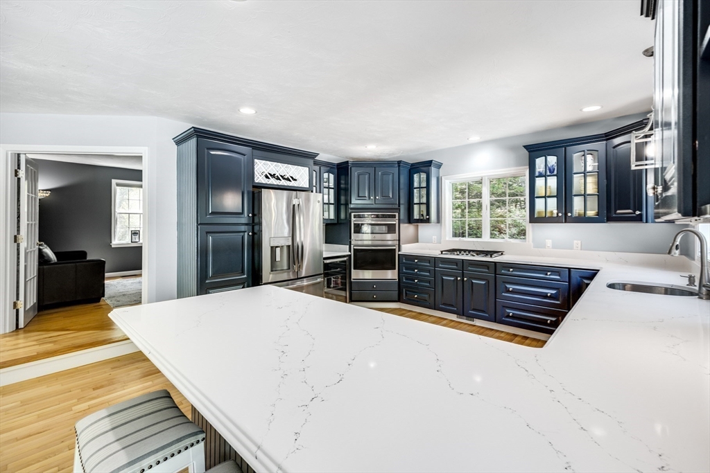 141 Cairn Ridge Road East Falmouth, MA 02536 - Photo 9 of 42 a large kitchen with stainless steel appliances a large counter top