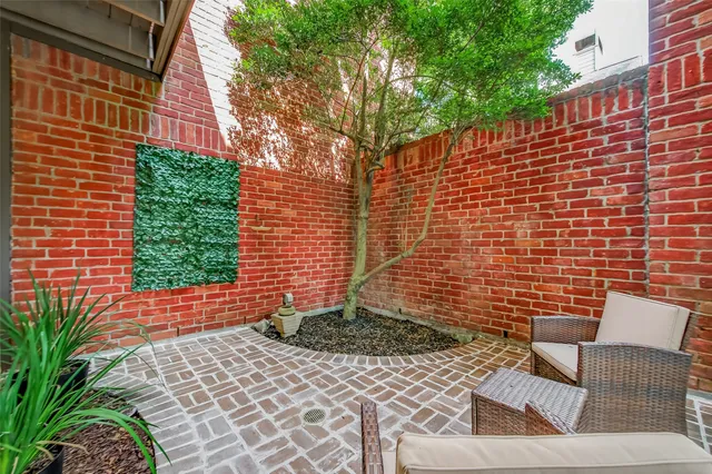a wooden bench sitting in front of a building