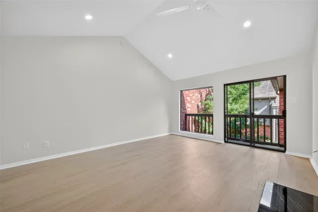 a bedroom with a bed and lamp