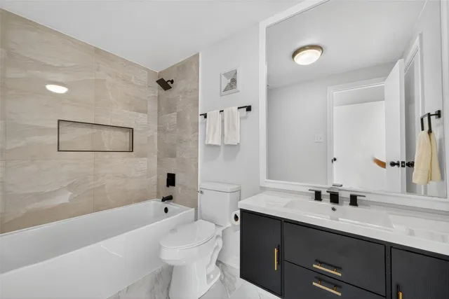 a utility room with sink dryer and washer