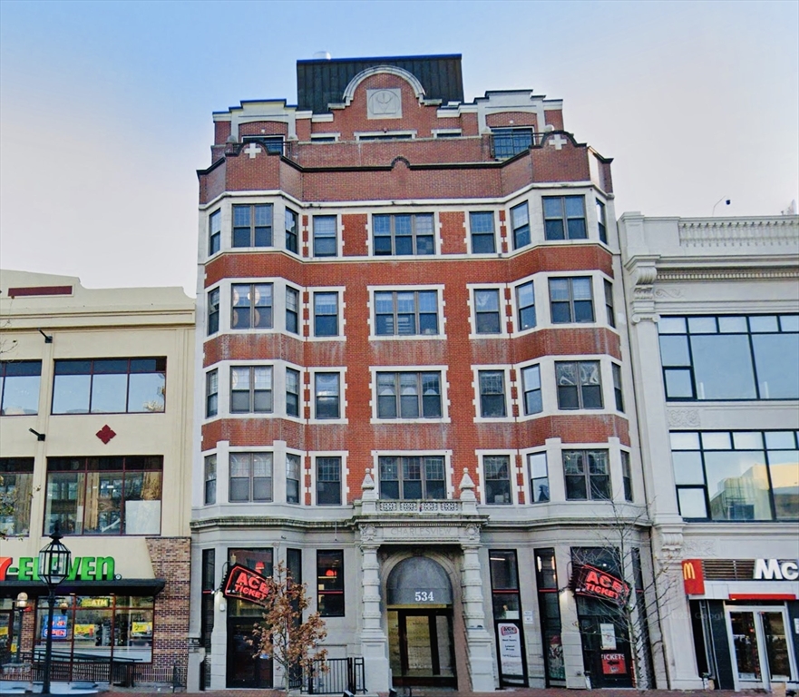 a front view of a building with many windows
