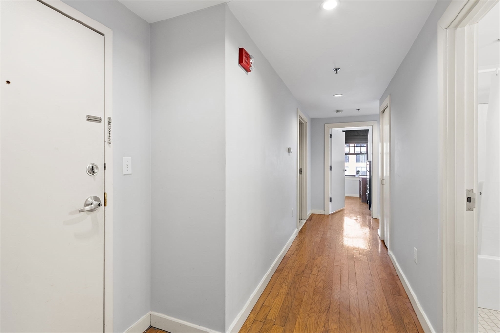 534 Commonwealth Avenue, Unit 3A Boston, MA 02215 - Photo 12 of 18 a view of a hallway with wooden floor