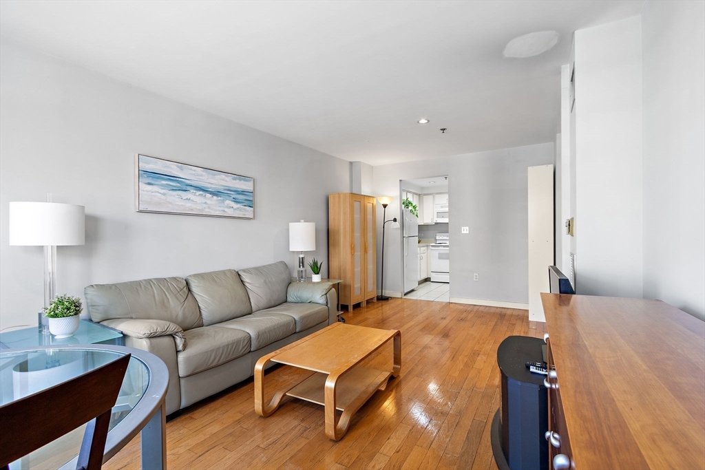 534 Commonwealth Avenue, Unit 3A Boston, MA 02215 - Photo 2 of 18 a living room with furniture and a wooden floor