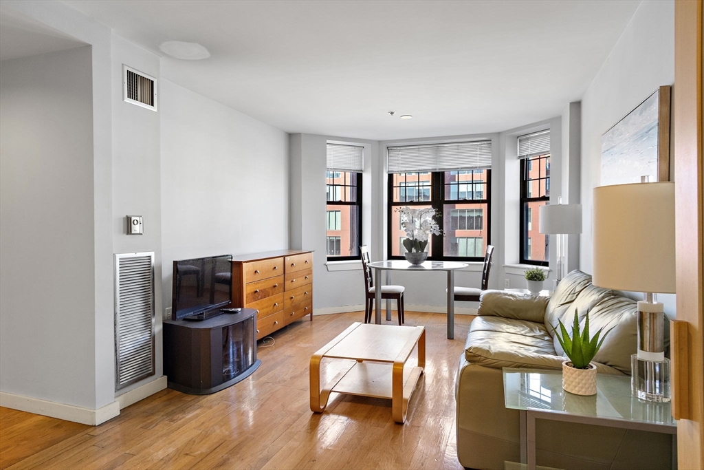 534 Commonwealth Avenue, Unit 3A Boston, MA 02215 - Photo 4 of 18 a living room with furniture and a window