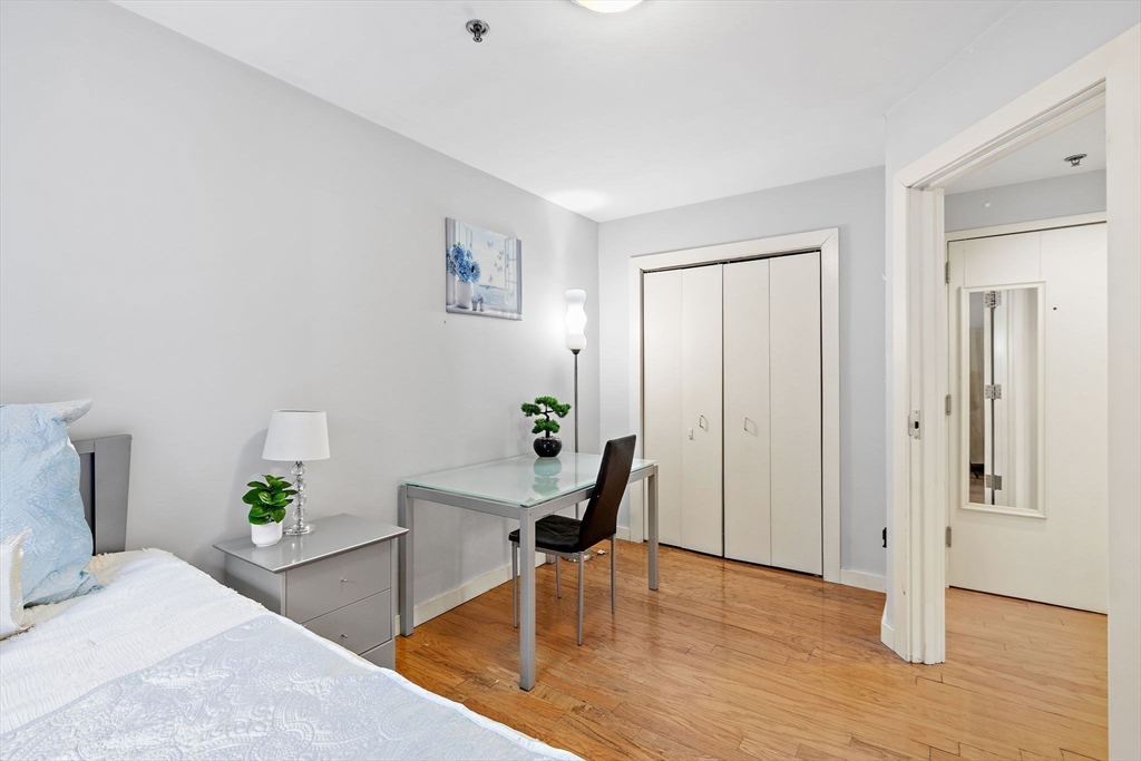 534 Commonwealth Avenue, Unit 3A Boston, MA 02215 - Photo 8 of 18 a living room with furniture and wooden floor