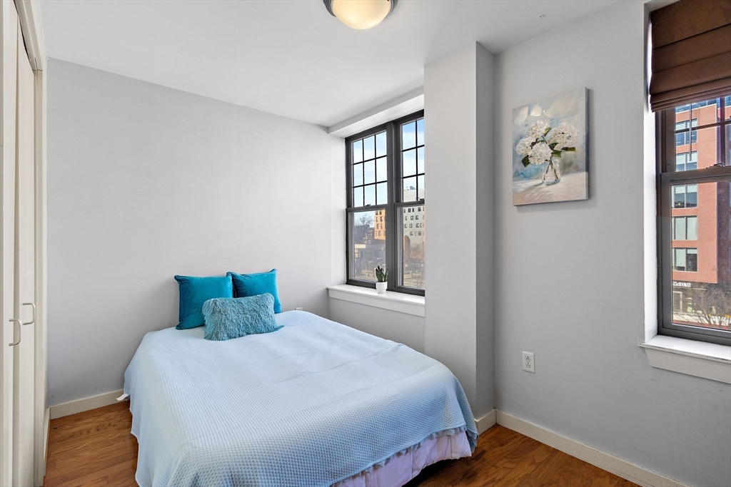 534 Commonwealth Avenue, Unit 3A Boston, MA 02215 - Photo 9 of 18 a bedroom with a bed and a window