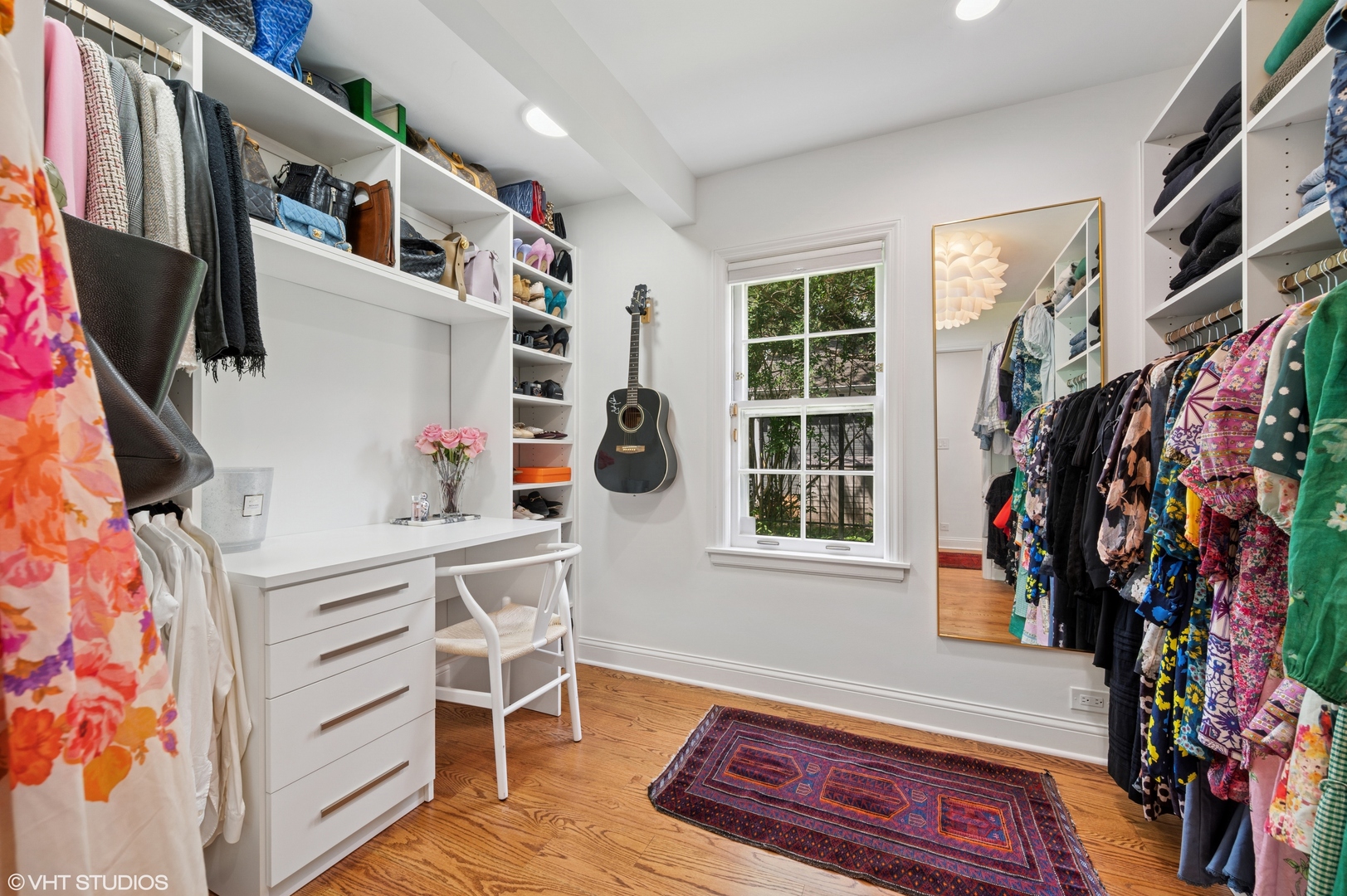 1560 Tower Road Winnetka, IL 60093 - Photo 18 of 27 a view of walk in closet with clothes and shoes