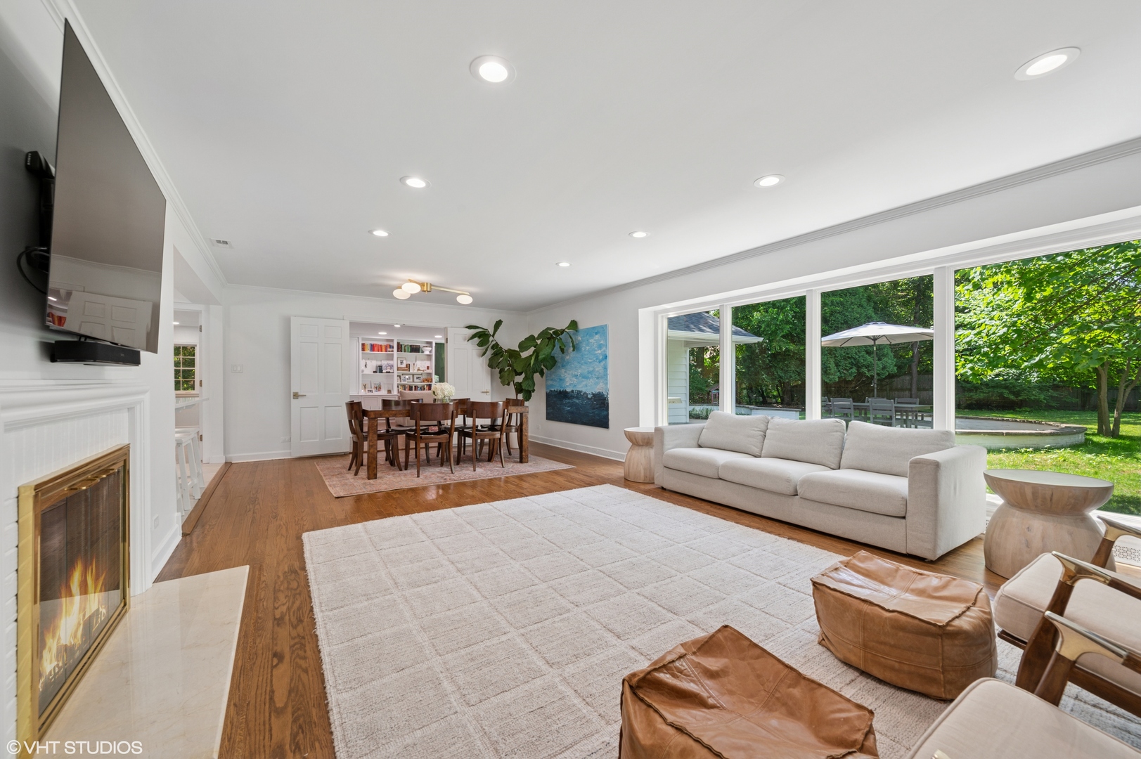 1560 Tower Road Winnetka, IL 60093 - Photo 2 of 27 a living room with fireplace furniture and a flat screen tv
