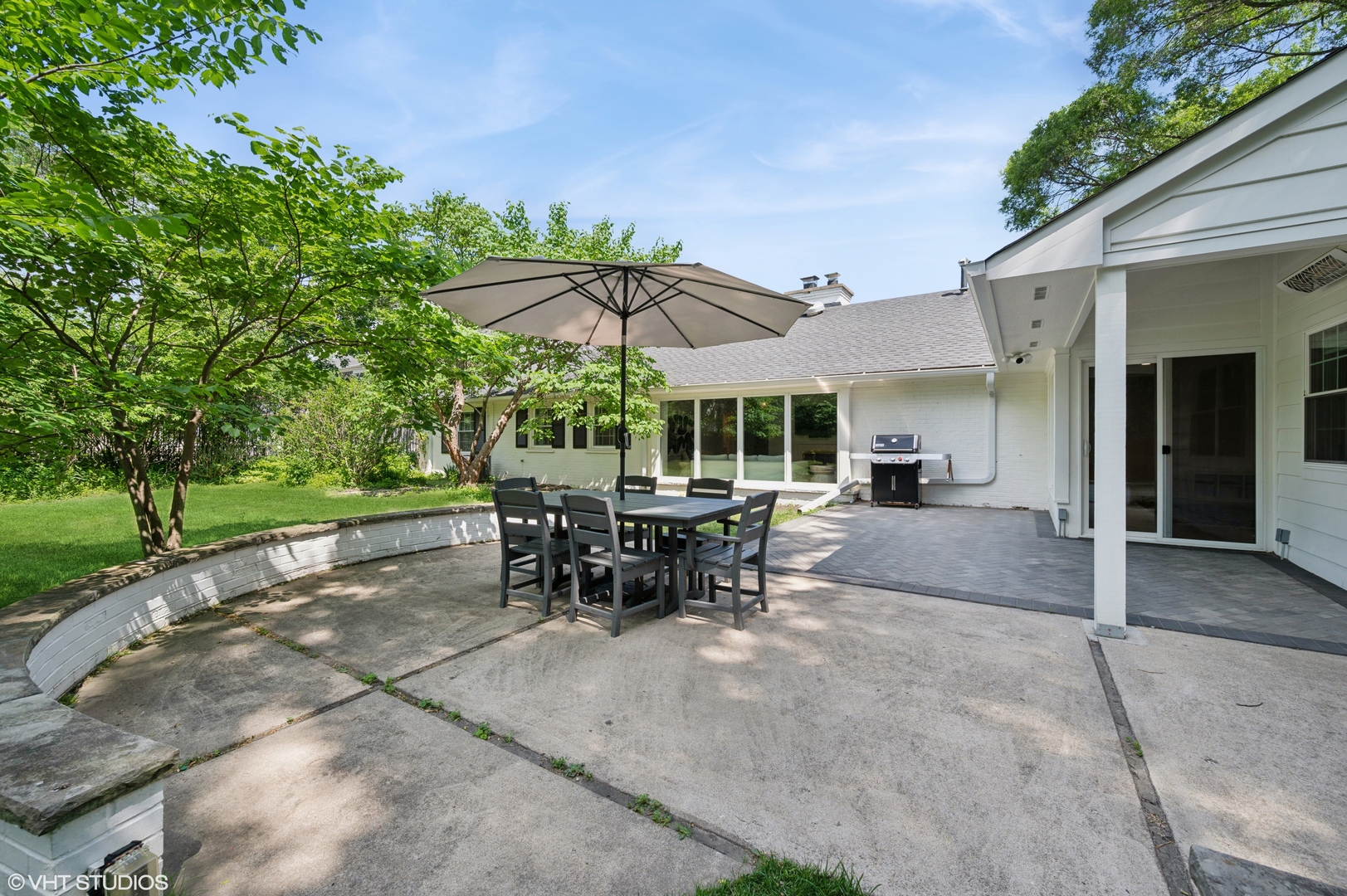 1560 Tower Road Winnetka, IL 60093 - Photo 24 of 27 a view of a patio with a table and chairs under an umbrella