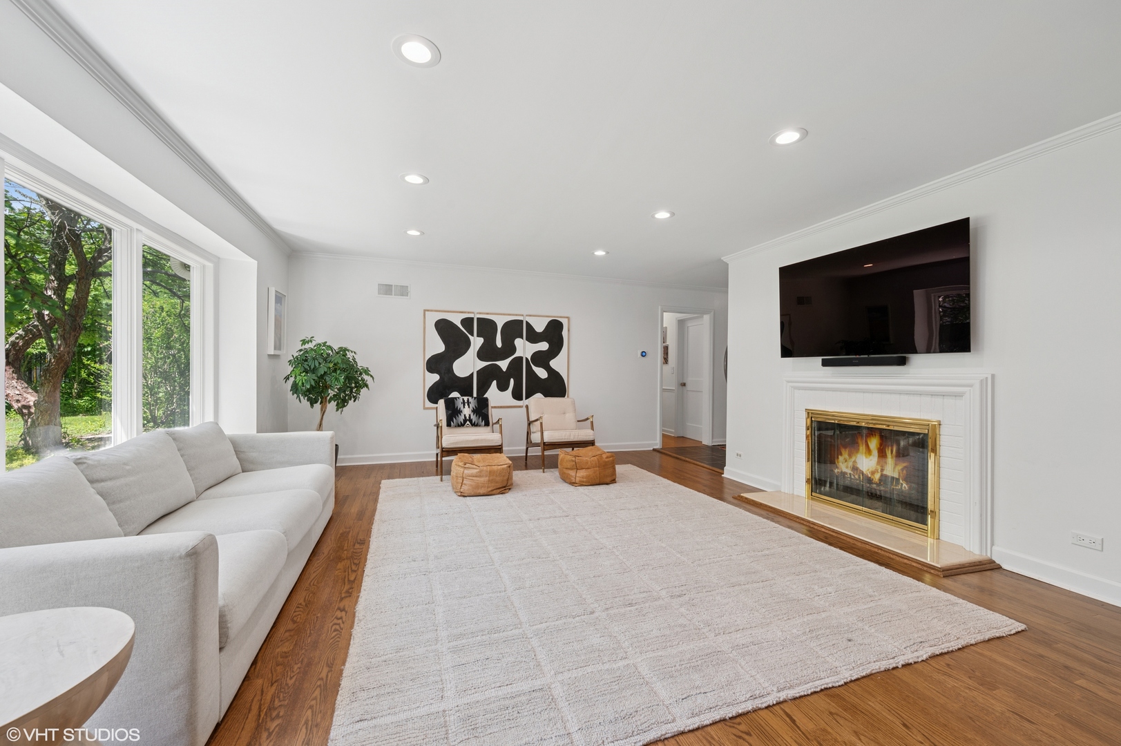1560 Tower Road Winnetka, IL 60093 - Photo 4 of 27 a living room with furniture and a flat screen tv