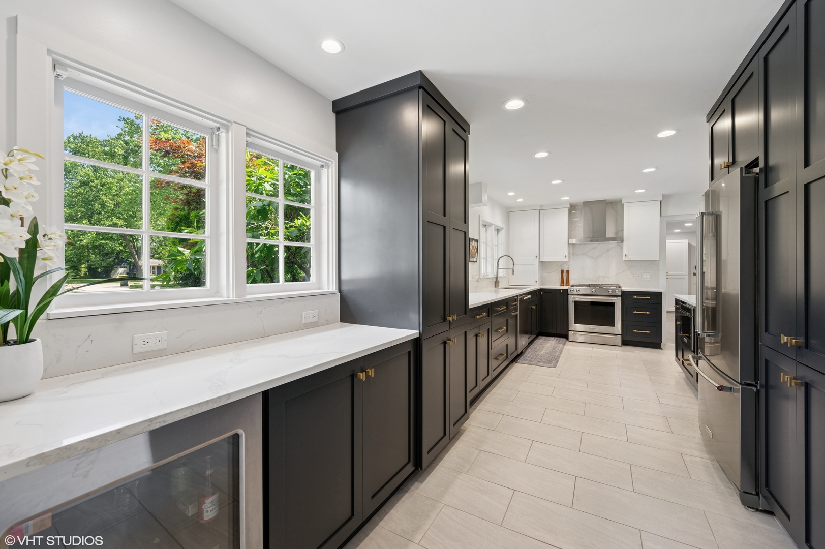 1560 Tower Road Winnetka, IL 60093 - Photo 9 of 27 a kitchen with stainless steel appliances a sink and a refrigerator