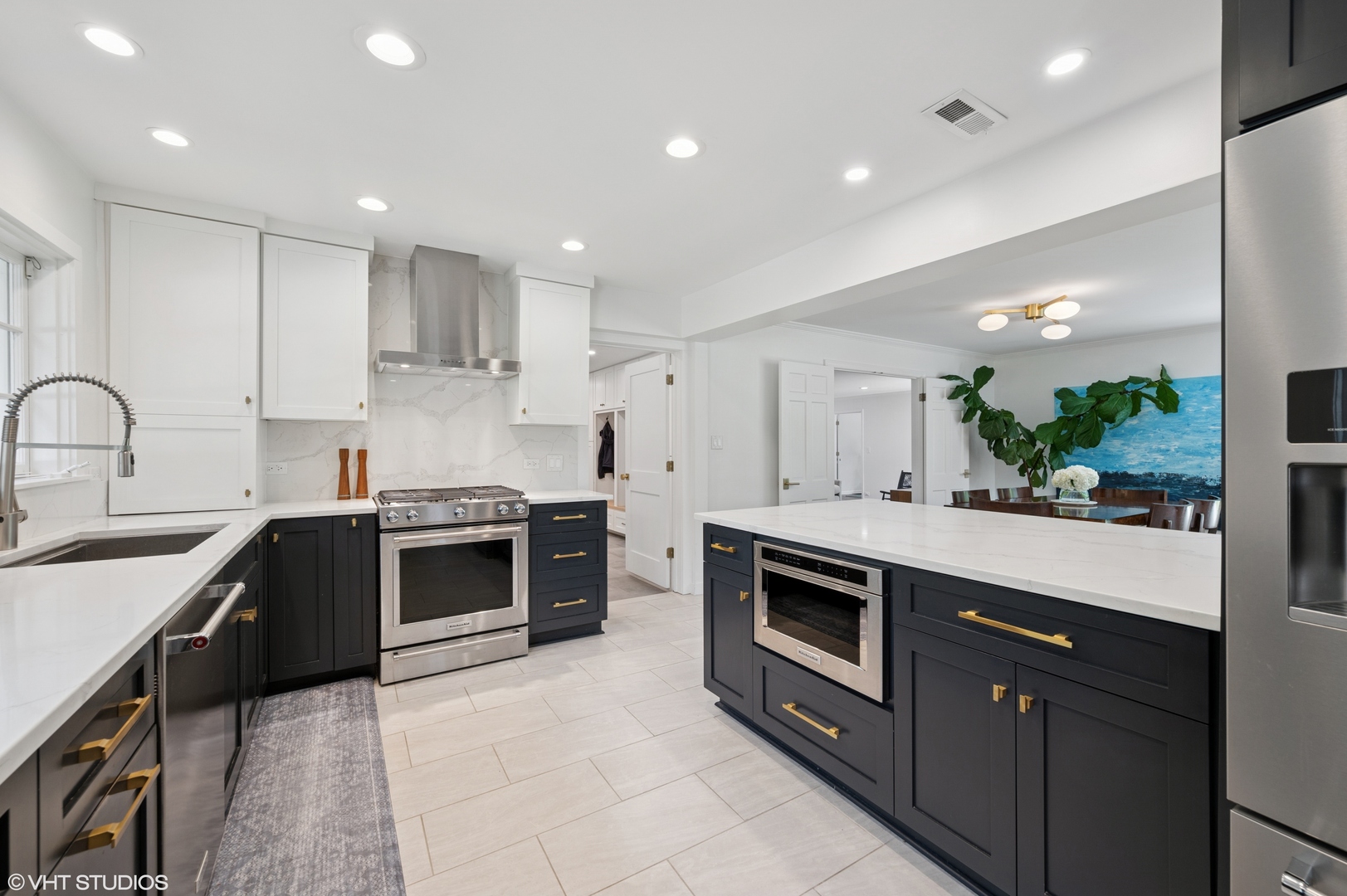 1560 Tower Road Winnetka, IL 60093 - Photo 10 of 27 a kitchen with stainless steel appliances granite countertop a sink a stove a refrigerator and a oven