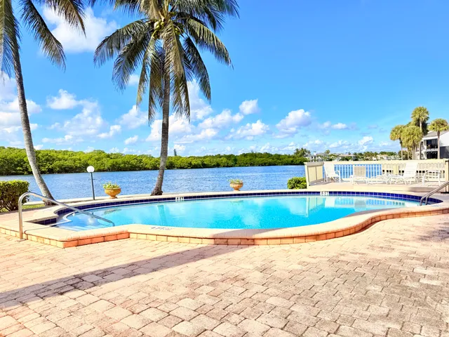 a view of a swimming pool and an outdoor space