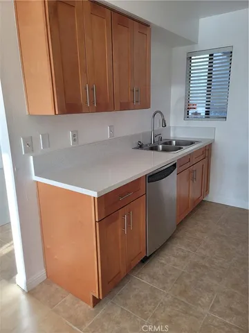 a kitchen with a stove microwave and refrigerator