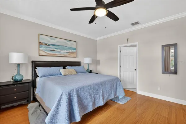 a work room with furniture wooden floor and a window