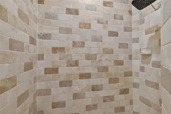 a kitchen with stainless steel appliances granite countertop a refrigerator and a stove