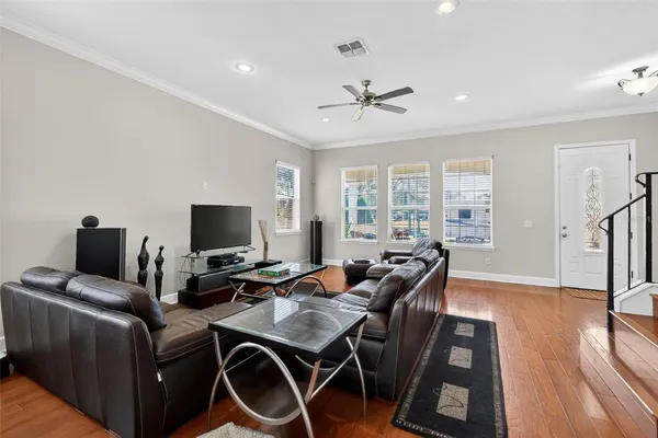 a view of an entryway with wooden floor and windows