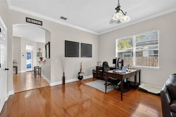 a bedroom with a bed and a desk