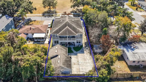 a living room with furniture a ceiling fan and a window