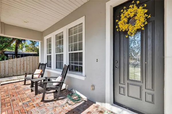 a room with furniture pool table and windows