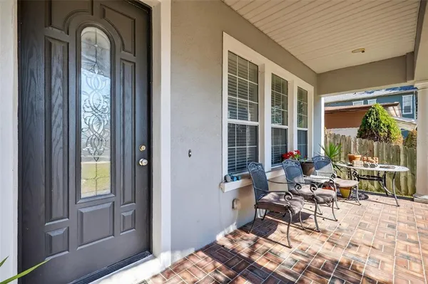 a living room with furniture pool table and a window
