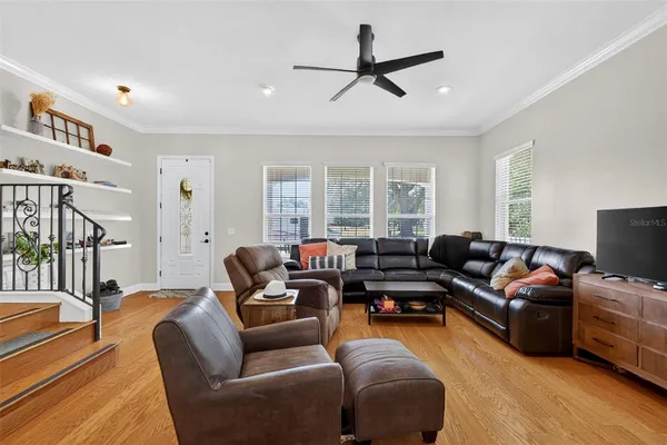 a view of a dining room with furniture and window