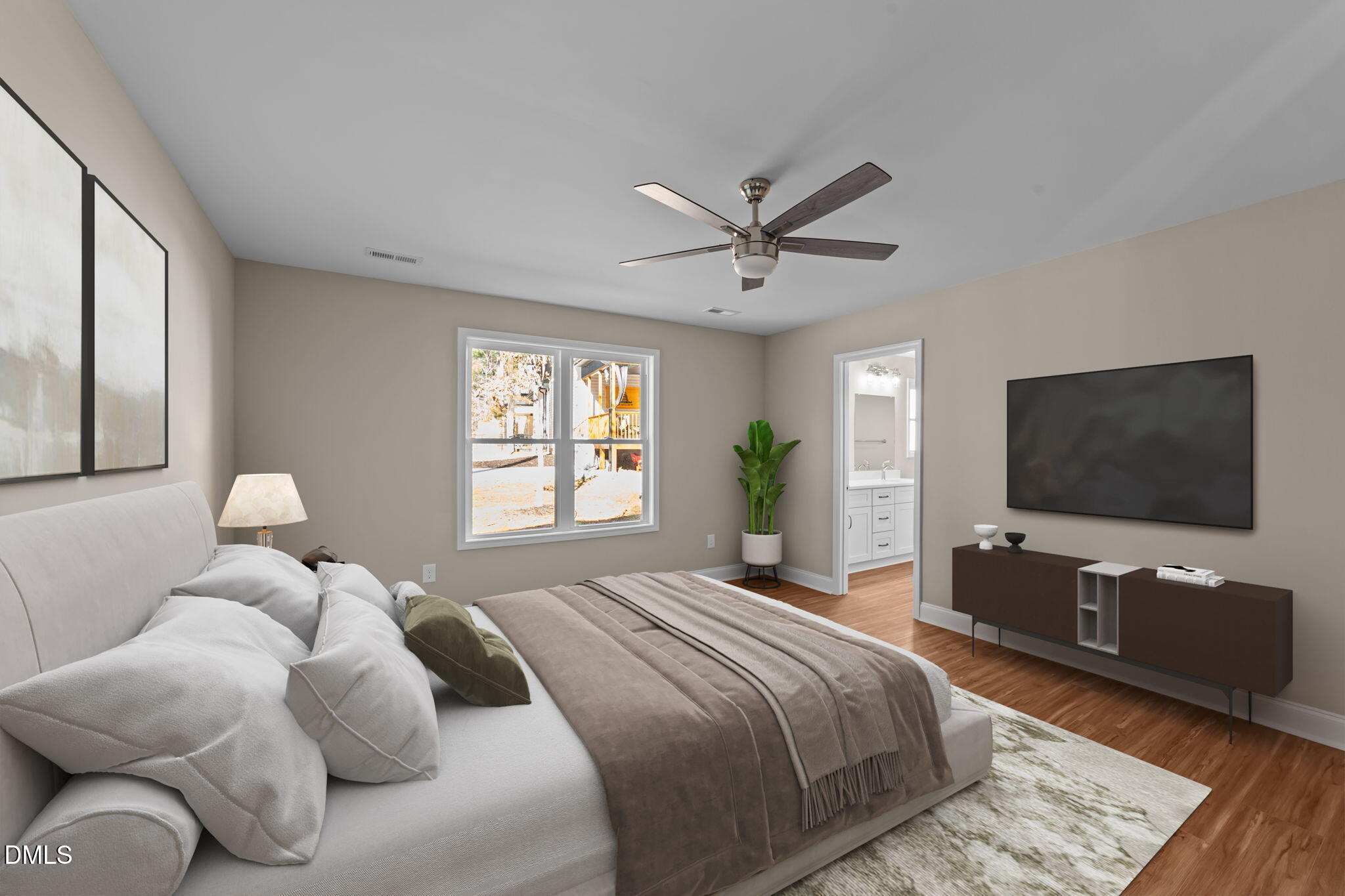 108 Wichita Way Louisburg, NC 27549 - Photo 10 of 55 a bedroom with a bed and a flat screen tv