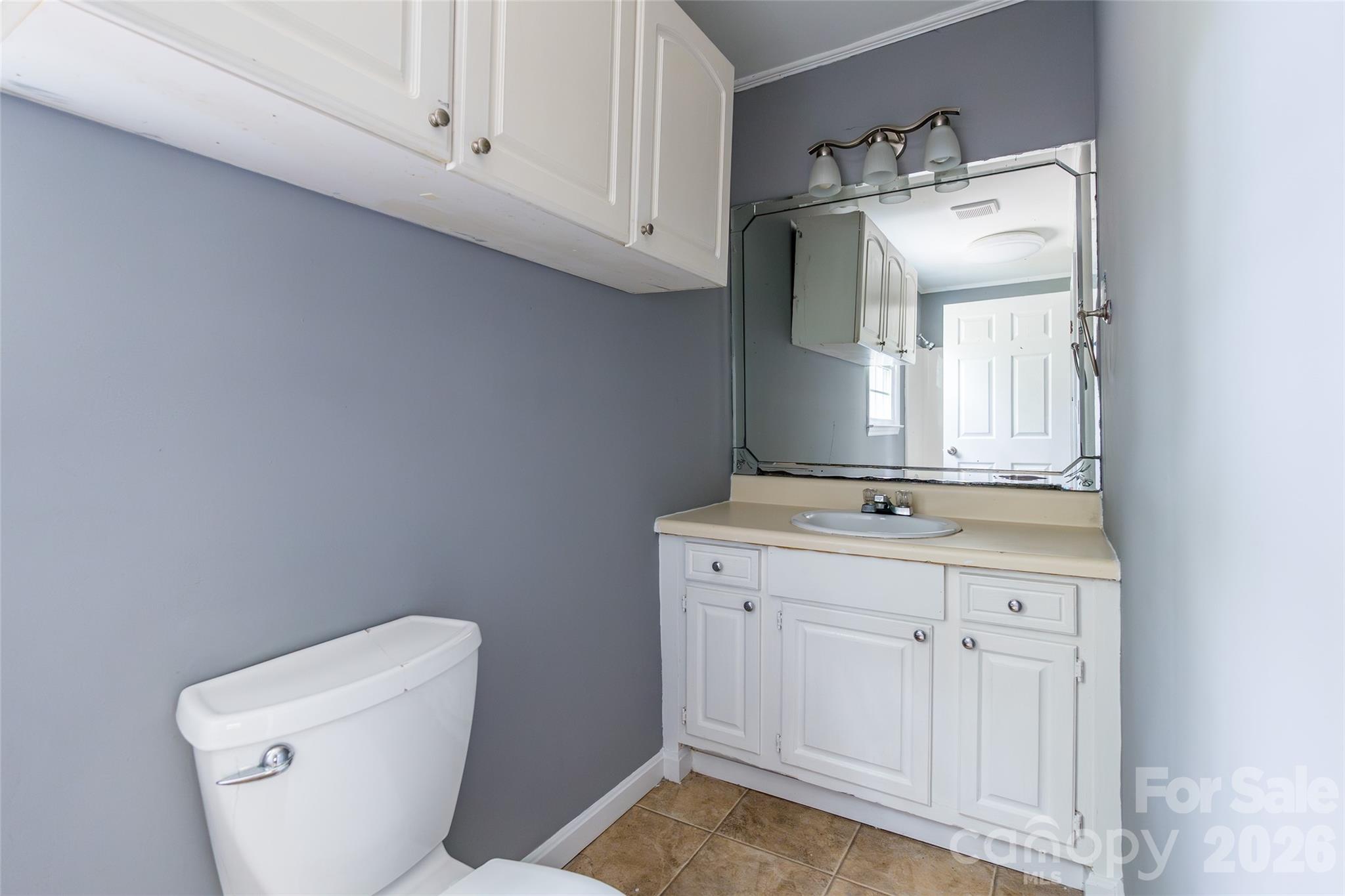 2823 Lyndell Way Lancaster, SC 29720 - Photo 14 of 19 a bathroom with a toilet sink and vanity