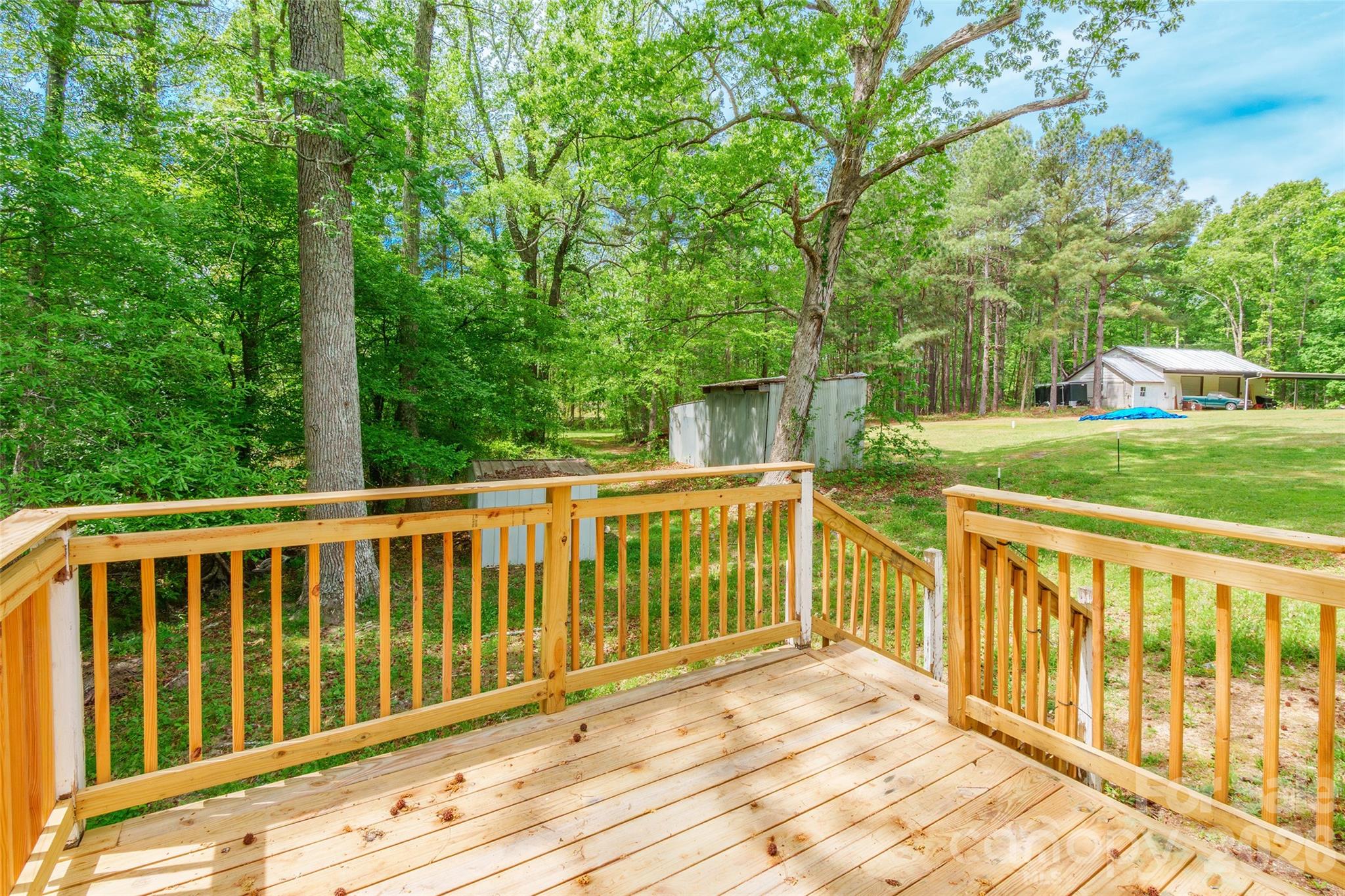 2823 Lyndell Way Lancaster, SC 29720 - Photo 16 of 19 a view of a wooden deck and a yard with swimming pool
