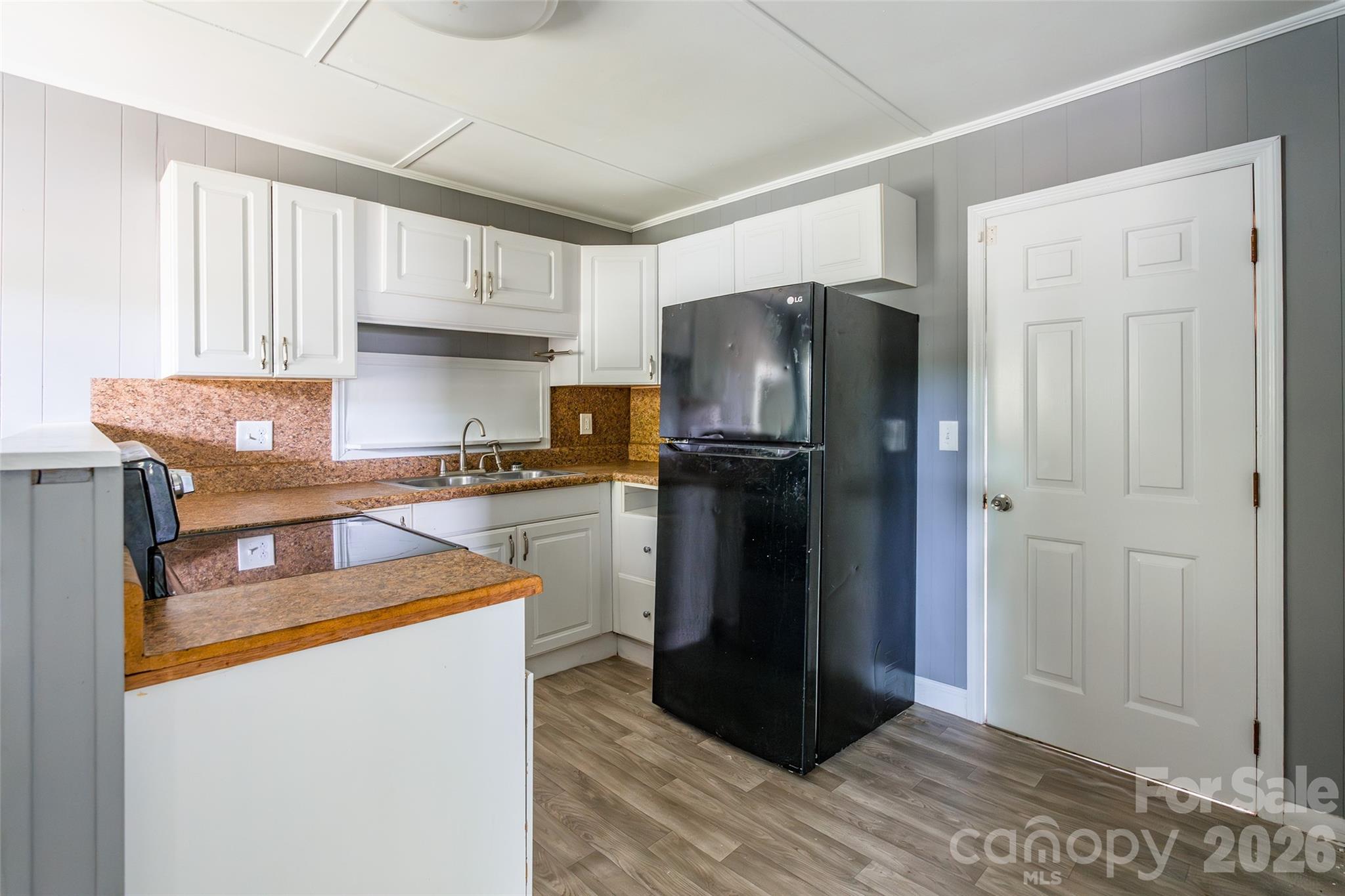 2823 Lyndell Way Lancaster, SC 29720 - Photo 4 of 19 a kitchen with stainless steel appliances granite countertop a refrigerator and a sink