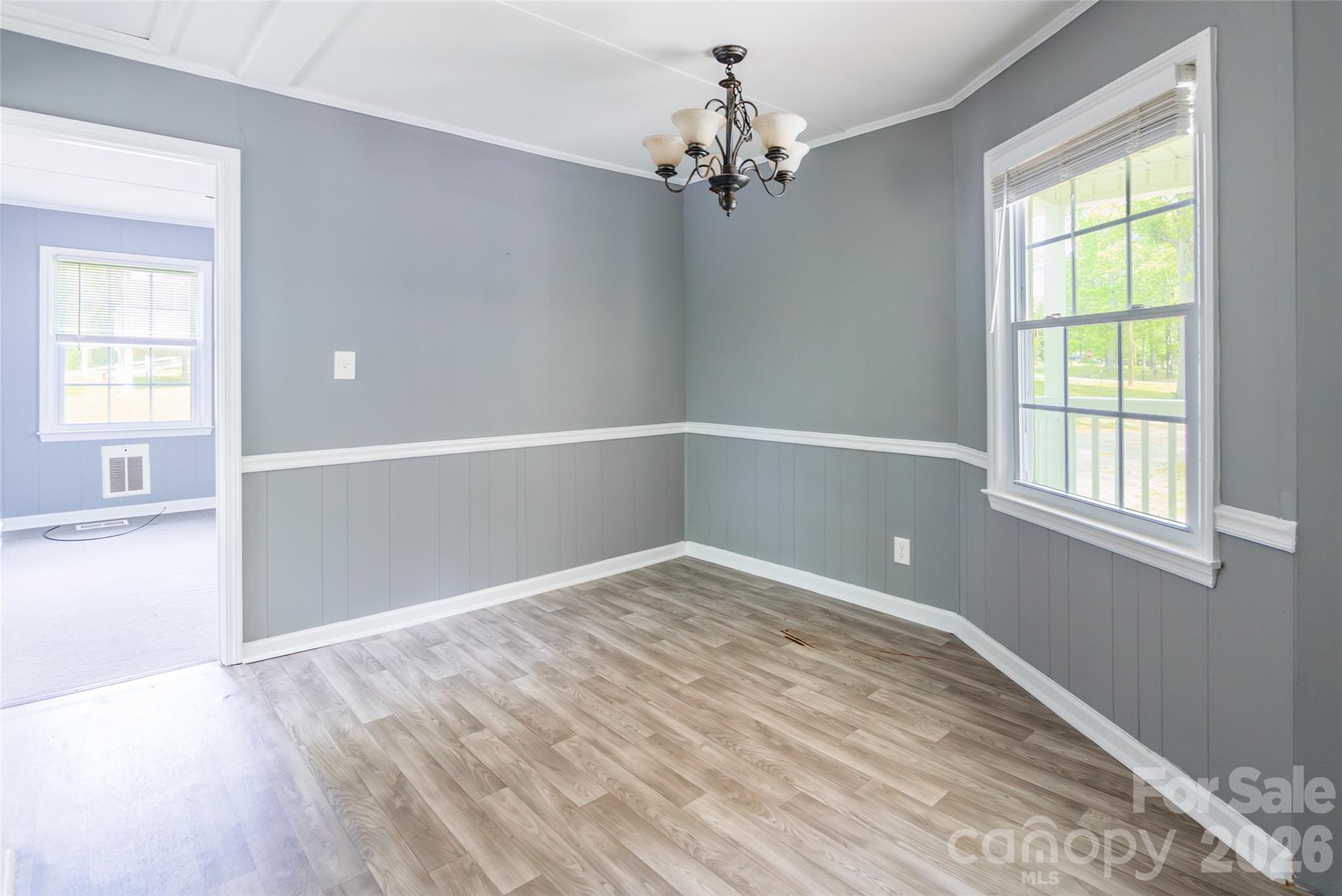 2823 Lyndell Way Lancaster, SC 29720 - Photo 6 of 19 a view of an empty room with wooden floor and a window