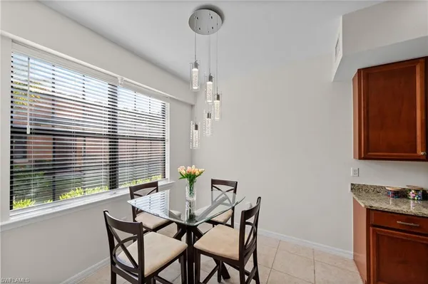 a view of a dining room with furniture and window