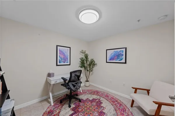 a workspace with furniture and wooden floor