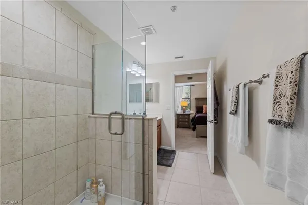a bathroom with a shower and a tub