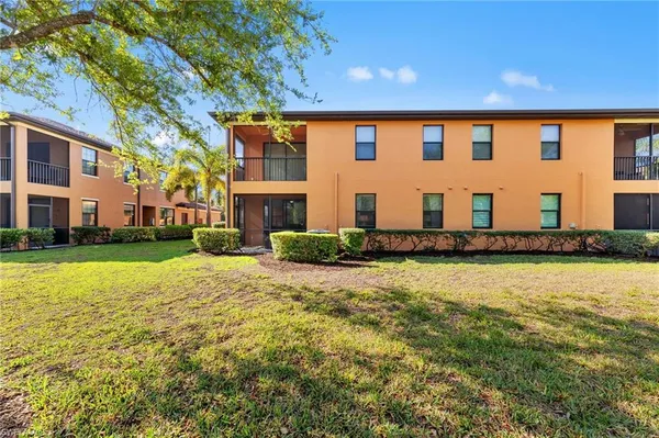 a front view of building with yard