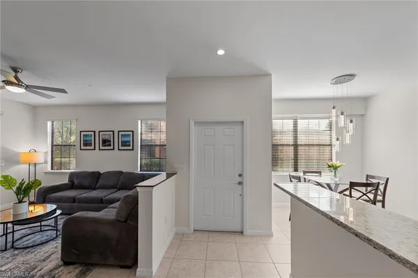 a kitchen with a sink and a refrigerator