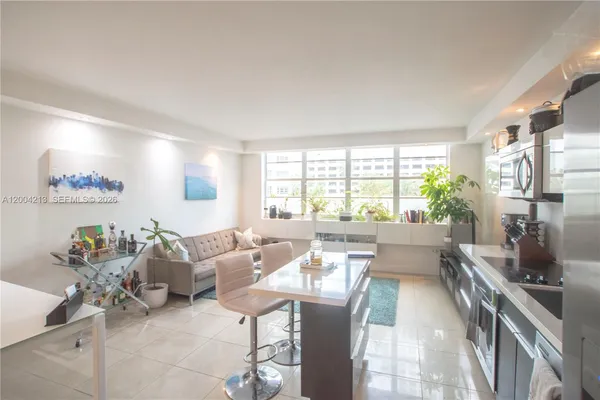 a living room with furniture and a large window