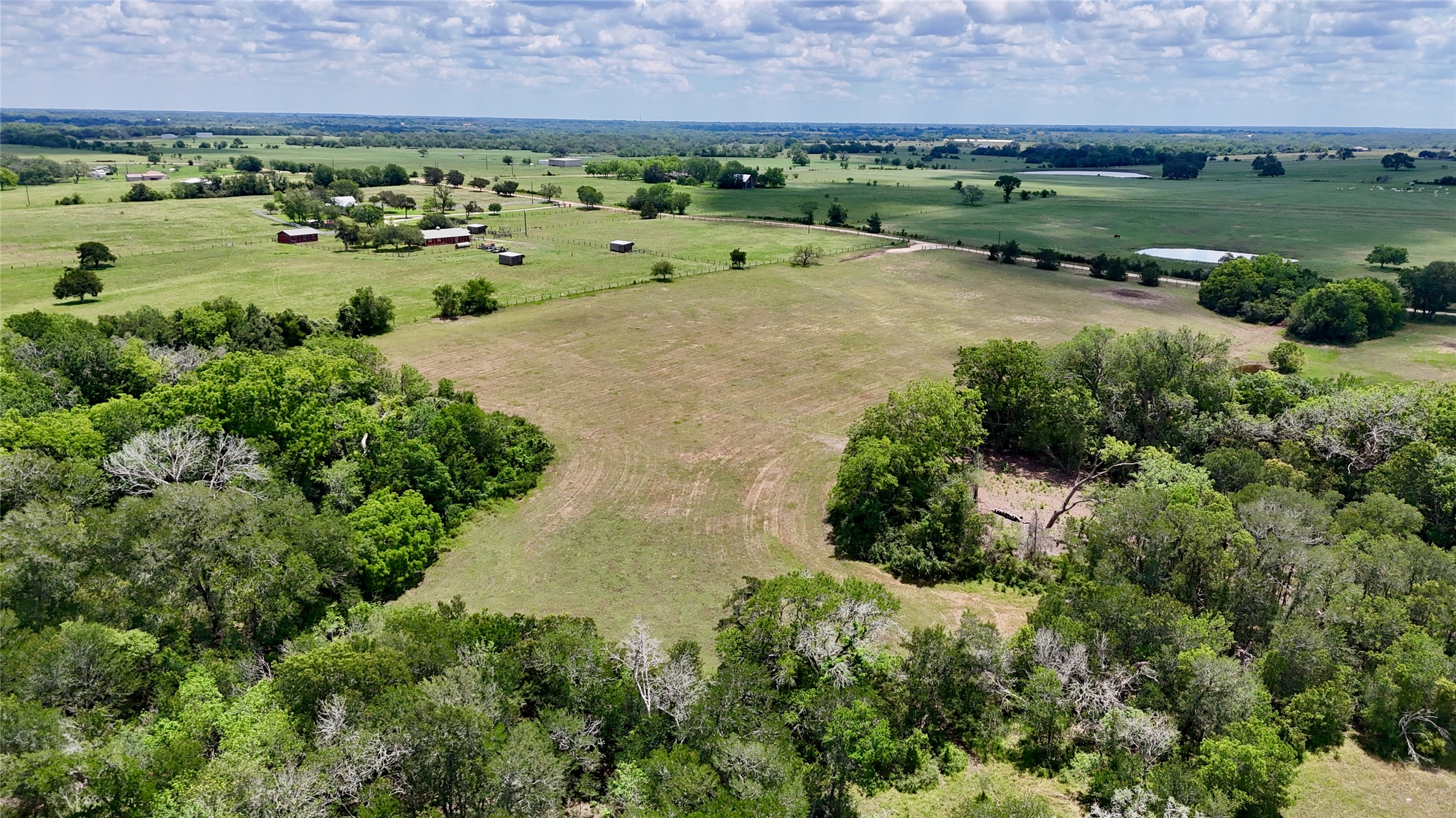 1049 Muehr Road Weimar, TX 78962 - Photo 2 of 24 an aerial view of a residential houses with outdoor space and trees