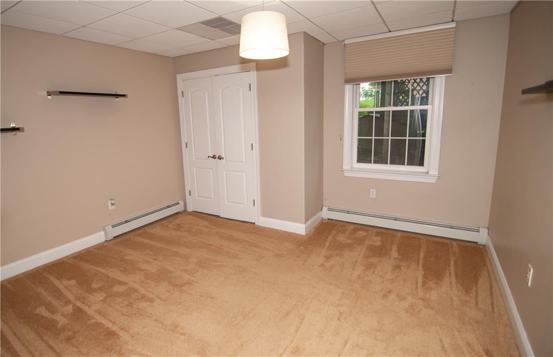 2202 High Meadow Road Coopersburg, PA 18036 - Photo 35 of 41 Baseboard heating and wall-to-wall carpeting define this versatile basement room with a single window.