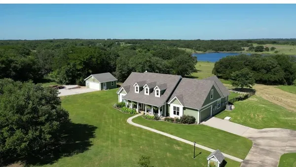 an aerial view of a house with garden
