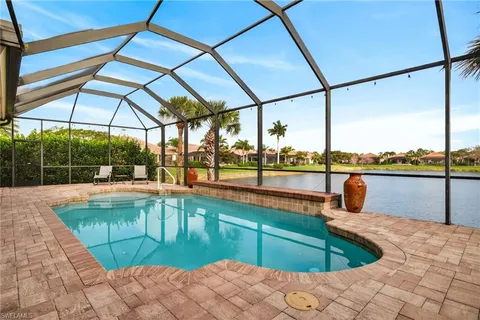 a view of swimming pool with outdoor seating