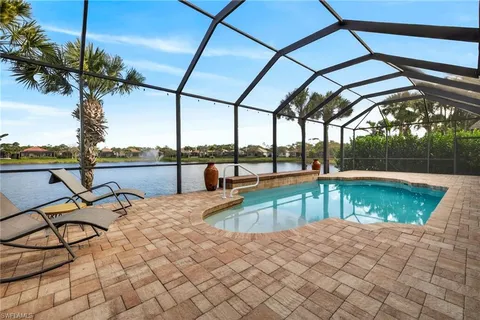 a view of a swimming pool with a patio