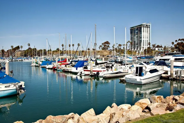 a view of a lake with boats and trees