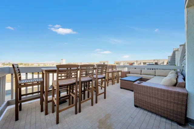 a outdoor living space with furniture and city view