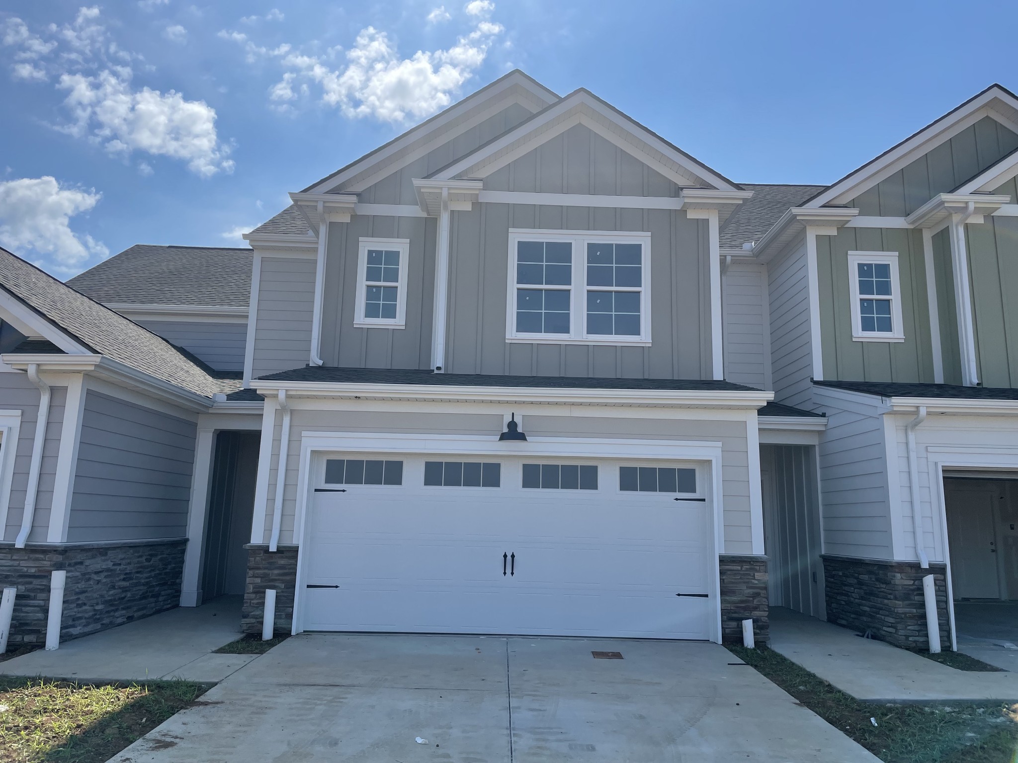 a front view of a house with a garage
